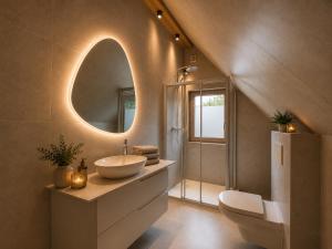 a bathroom with a sink and a mirror at Book-A-Room Salzburg Garden or Balcony Stay - 2 bedroom - air conditioning & free parking in Salzburg +32 photos
