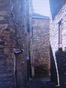 an alley in an old brick building at casa della marsiglia in Curiglia
