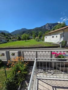 a view of a balcony with flowers at Piccola Stella in Moggio Udinese