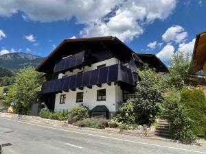 a house with solar panels on the roof at Ferienwohnung Brandmaier in Unken