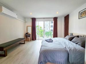 a bedroom with a bed and a large window at Sena living Tiwanon Rd in Ban Bang Kradi (1) +146 photos