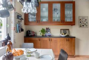 a kitchen with a table with plates of food on it at Villa in Gothenburg in Gothenburg