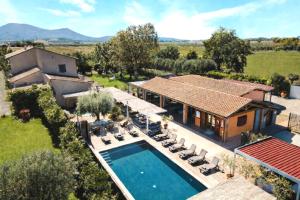 an aerial view of a house with a swimming pool at Country Resort Le Due Ruote in Alberese