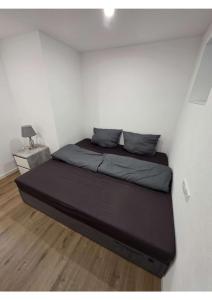 a bed in a small room with at YourHome 2 in Haigerloch