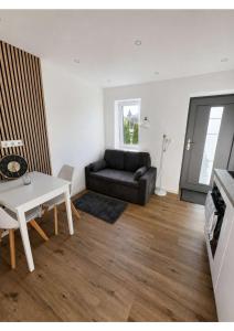 a living room with a couch and a table at YourHome 2 in Haigerloch