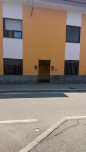 a building with a door on the side of a street at Luna in Novara