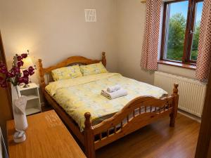 a bedroom with a bed with towels on it at North Dublin 2-Bed House Sleeps 4 in Dublin