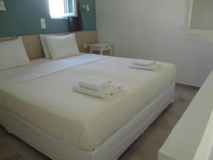 A bed or beds in a room at Theodosia Studios