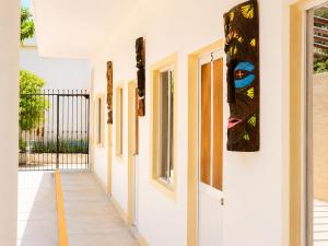 a hallway of a building with paintings on the walls at Punta Sol in Brisas de Zicatela