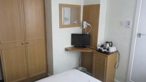 En eller flere senge i et værelse på The Rowan Hotel + 41 billeder