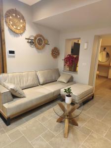 a living room with a couch and a table at Villa Sivo in Kolymbia