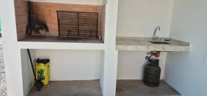 a kitchen with a sink and a counter top at El hogarcito in Cafayate +7 photos