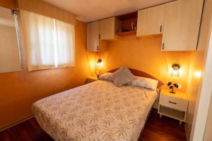 a small bedroom with a bed and a window at Villa Thiago in Cádiz +37 photos