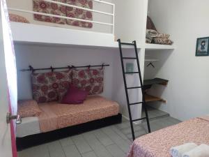 a bedroom with a bunk bed and a ladder at Casa Tanger in Tangier +19 photos