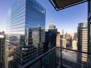 a view of the city from the balcony of a skyscraper at Pristine Modern 2BR Condo Private BBQ and Balcony in Toronto