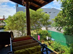 a view from the balcony of a house with trees at Ama HomeStay Guest Colombo in Rajagiriya