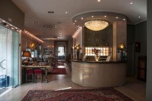 a lobby with a bar in a building at Esperia Boutique Hotel in Agrinio