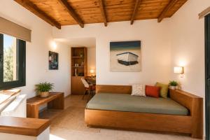 a living room with a couch and a table at Margarita's Villas in Chania +216 photos