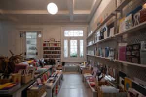 a room filled with lots of books on shelves at Hotel Casa Bosques Pensión in Mexico City