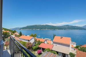 a view of a town on the water at Villa Bokeljka in Krašići