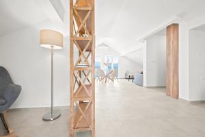 a room with a wooden ladder in the middle of a living room at Villa Bokeljka in Krašići +122 photos
