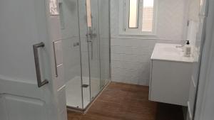 a bathroom with a shower and a sink at Sunny terrace flat in Ceuta