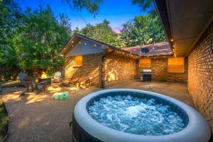a hot tub in the backyard of a house at FIFA World Cup Backyard Retreat in Dallas