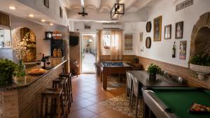 a bar with a pool table in a restaurant at EL CHORRO Aire acondicionado Bar privado Barbacoa Amplios patios in Castalla