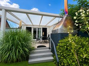 a house with a patio with a grill at Sweethome - Köln Messe in Bergisch Gladbach