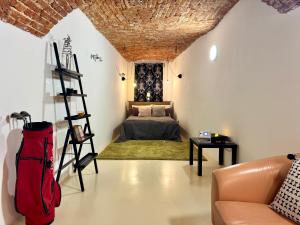 a living room with a couch and a bed at Vila Kralj in Podčetrtek