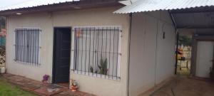 a house with bars on the side of it at Mi Paraiso in General Pico