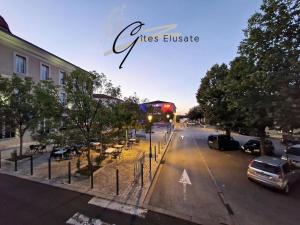 a view of a city street with a bus at Le Charme in Eauze