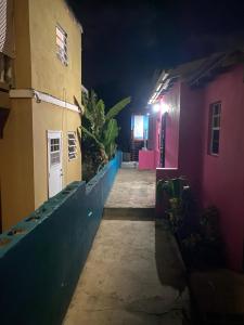 a hallway leading to a house at night at Attres in Monkey Hill