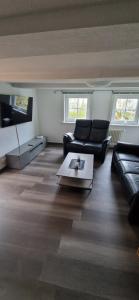 a living room with a couch and a coffee table at Dehmkerhof in Aerzen