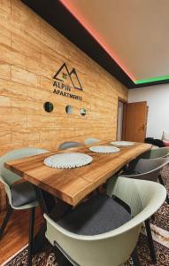 a conference room with a wooden table and chairs at Alpin Wellness & Spa Vlašić in Vlasic +60 photos