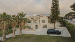 a black car parked in front of a house at Casa di Mare in Kyparissia