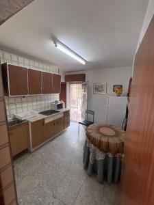 a kitchen with a table in the middle of a room at Eclipse in Villasandino