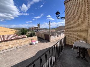 a balcony with a lamp on a brick wall at Eclipse in Villasandino