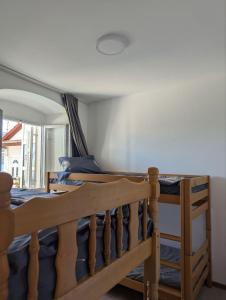 a bedroom with two bunk beds in a room at Sanrise Hostel in Baošići +6 photos
