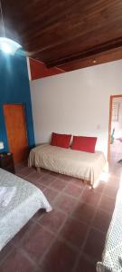 a bedroom with two beds in a room at Cabaña LDM cc in Santa Rosa +1 photo