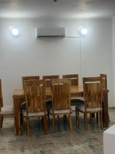 a dining room with a table and chairs at Cabaña Sueños del Mar in Santa Marta