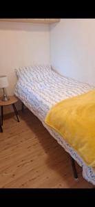 a bed sitting in a room with a table at Clonvilla Mobile Chalet in Cromponn Bridge