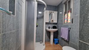 a small bathroom with a sink and a toilet at Gran Areatxa Home Mountain in Santiago de la Espada +29 photos