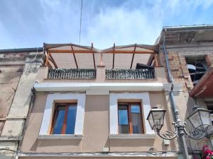 a building with a balcony on top of it at Casa Conti Trivelli 2 in Vasto