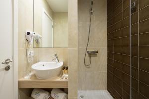 a bathroom with a sink and a shower at Predicados do Douro Palace in Porto +76 photos
