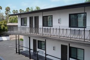 a balcony on a building with a parking lot at Nox Hotel - Studio City in Studio City