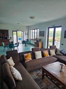 a living room with a couch and a table at Belvedere Chalet Bran in Bran