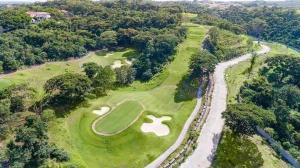 an overhead view of a golf course with a road at Prime Zen in Silang