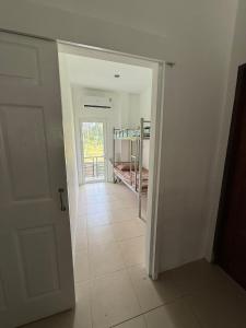 a hallway with a door leading to a room at olivia village pool resort in Mae Nam
