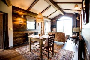 a dining room with a table and chairs at Clover in Wrenbury +26 photos